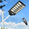 16000W Solar Street Lights Outdoor 100000 Lumens Dusk to Dawn Motion Sensor Security Flood Light with Remote Control Wireless Waterproof Perfect for GardenYard Street Parking lot