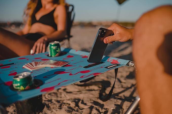 Neso Beach Table - Lightweight Portable and Foldable Table for Beach Camping and Outdoor Adventures - Stable Surface - with Cup Holder for Drinks and Phone Pockets - Flamingos