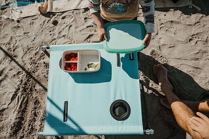 Neso Beach Table - Lightweight Portable and Foldable Table for Beach Camping and Outdoor Adventures - Stable Surface - with Cup Holder for Drinks and Phone Pockets - Seafoam