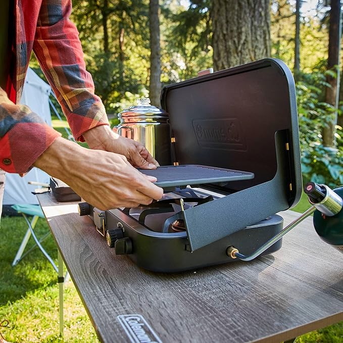 Coleman 1900 Collection 3-in-1 Propane Camping Stove Cast Iron Grill &amp Griddle Accessories Included 24000 BTUs Across 2 Adjustable Burners with Wind Guards &amp Matchless Lighting