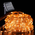 YEGUO Solar Christmas Light Outdoor Waterproof 66ft 200 LED Orange Rope Lights 8 Modes Tube String Lights in Clear Thin Tube